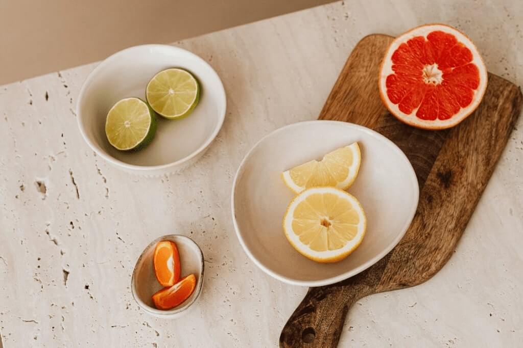 A variety of sliced-up citrus fruits