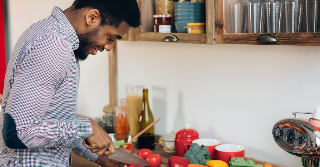 Man Cutting Up Vegetables