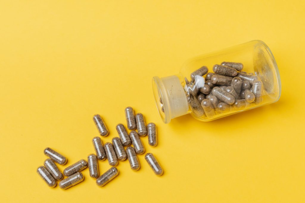 Capsules spilling out of a jar