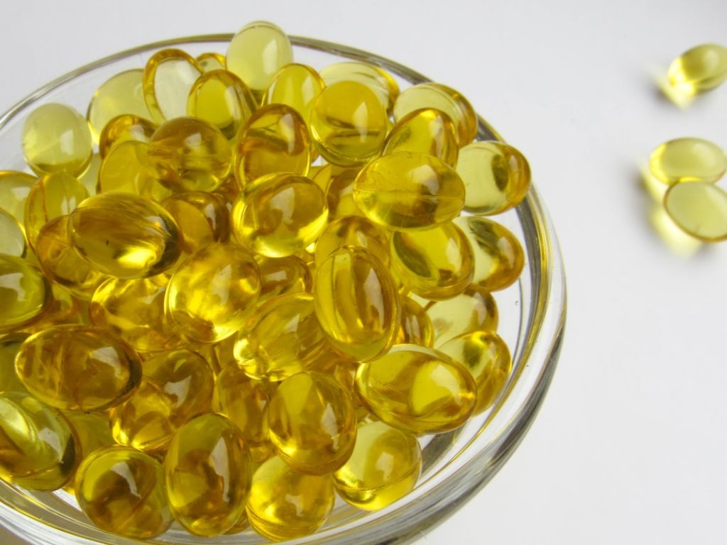 Vitamin D supplements in a glass bowl