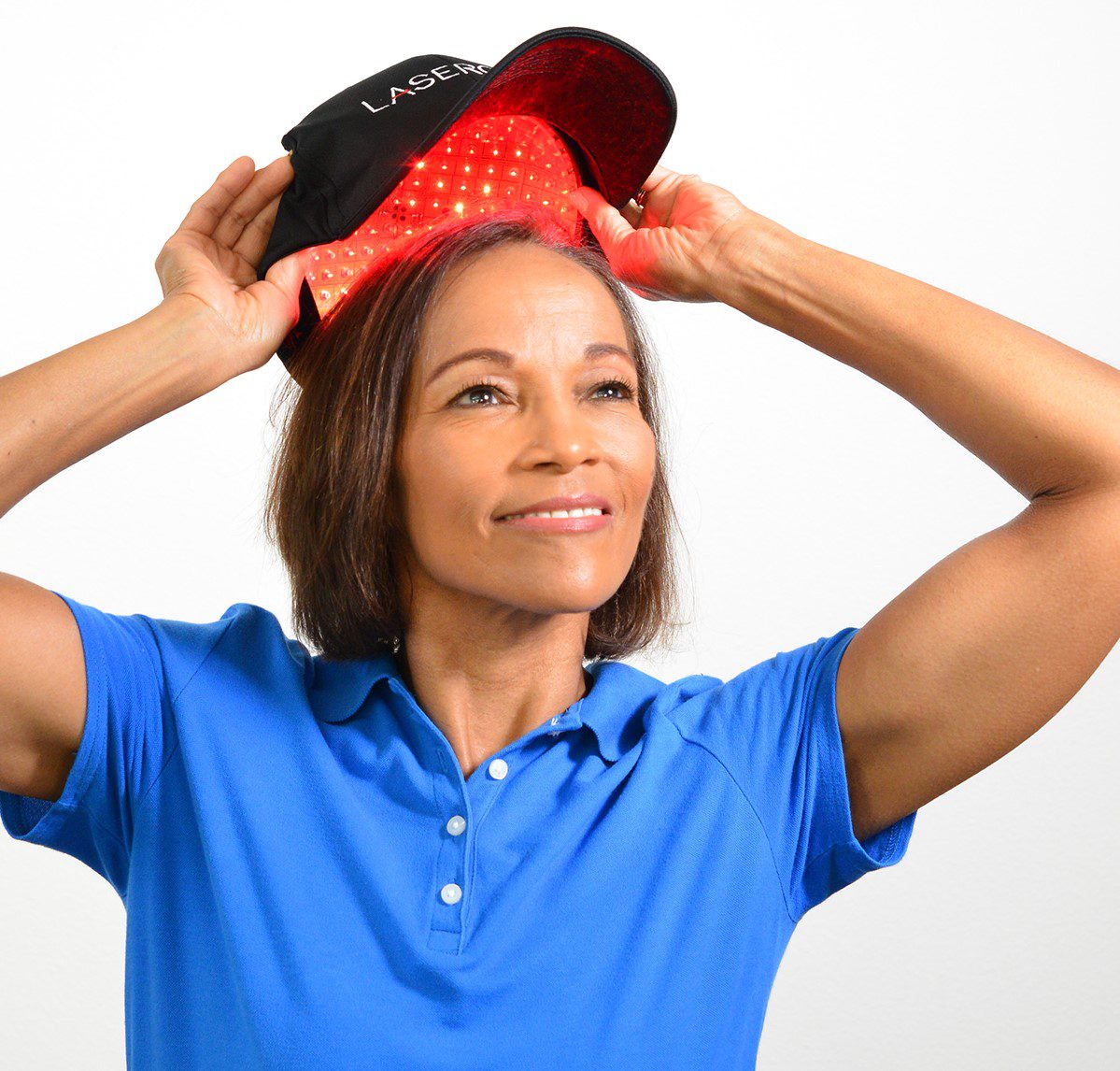 Woman putting on LaserCap