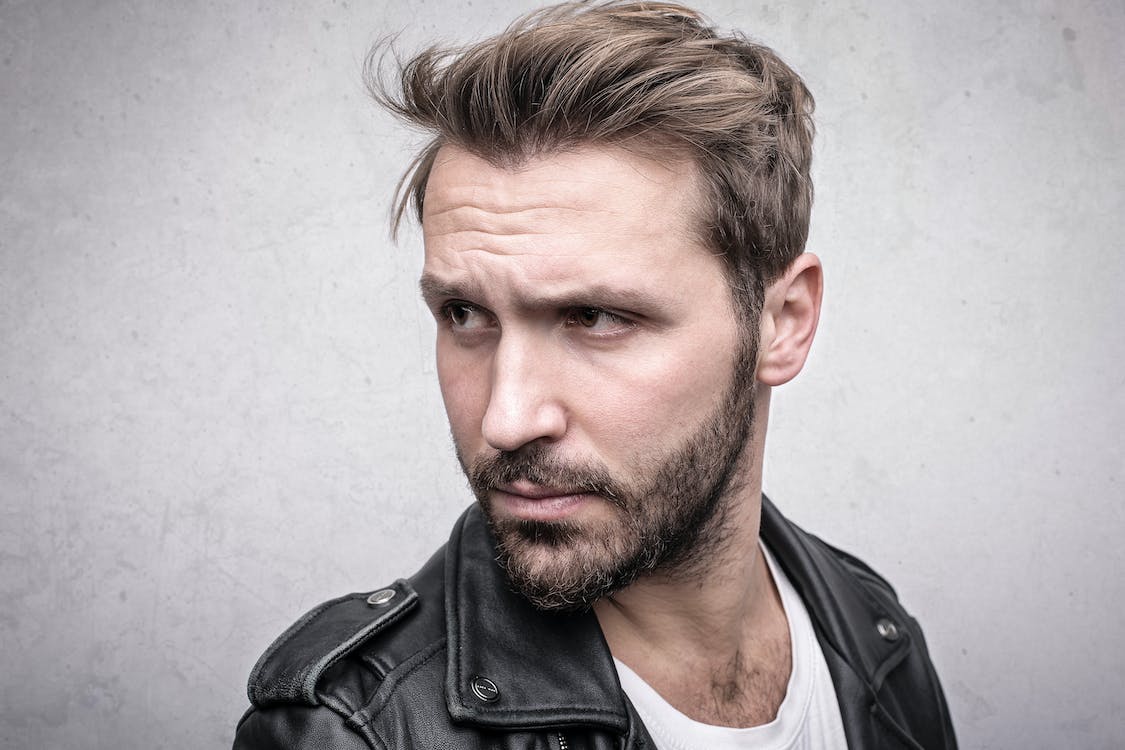 A bearded man with thinning hair