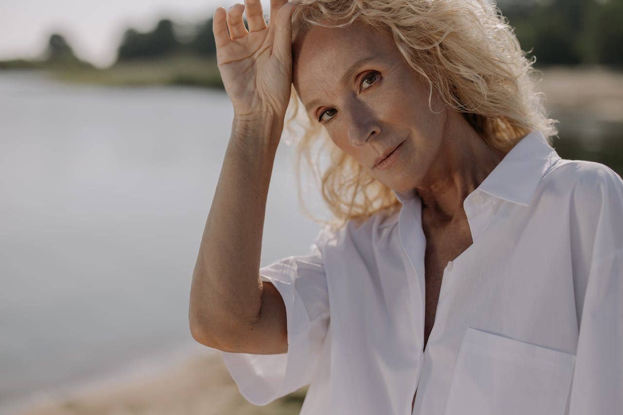 A woman in a white-collared shirt