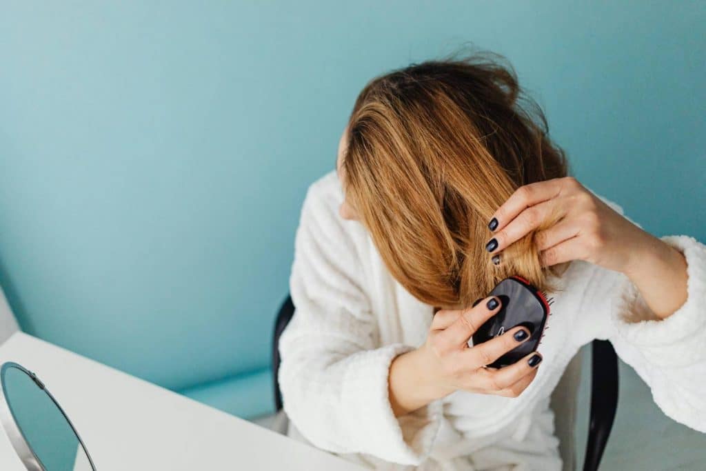 A woman brushing her hair